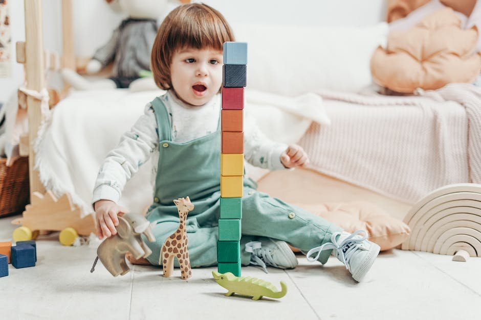 Image depicting a child playing with toys, representing autism early signs
