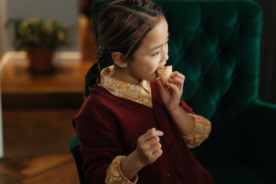 Image of a child with autism eating bread, representing their dietary preferences