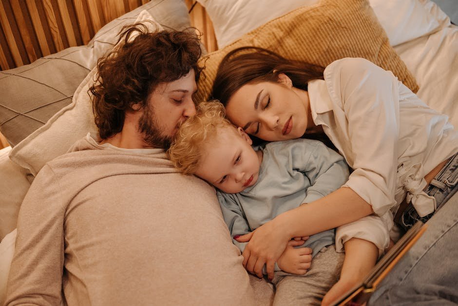 Image depicting a family supporting a child with autism during sleep disturbances