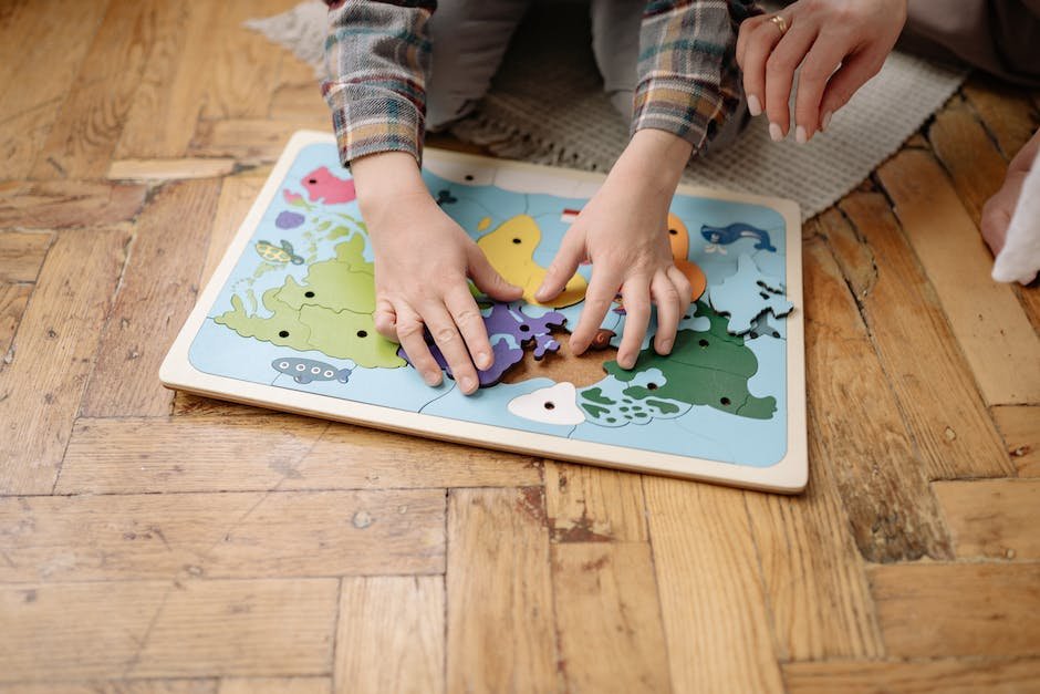 Image of a child with autism playing with a puzzle, illustrating the importance of play in teaching adaptive skills for children on the autism spectrum.