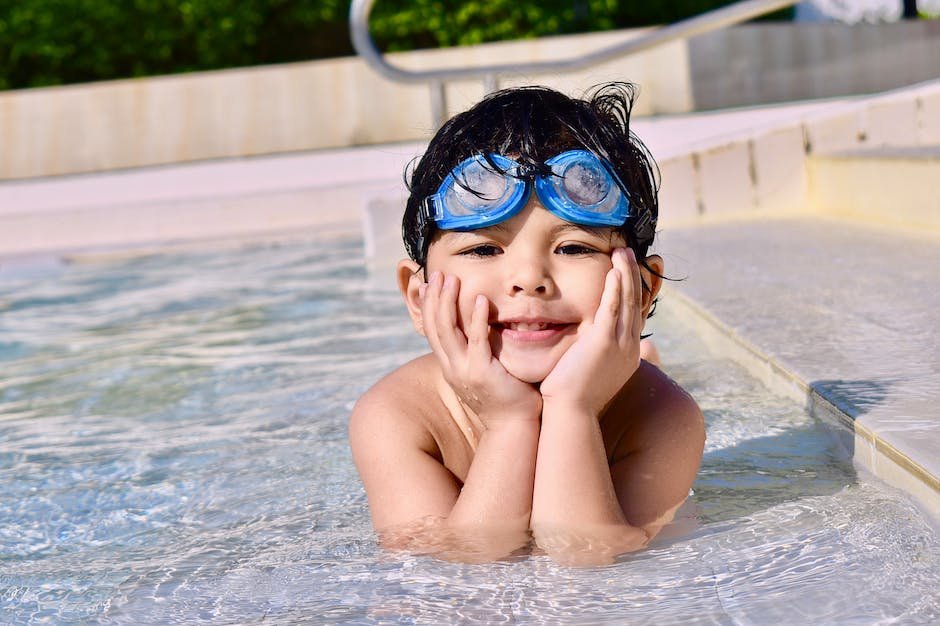Image of a child with autism swimming, highlighting the challenges they may face in physical activities