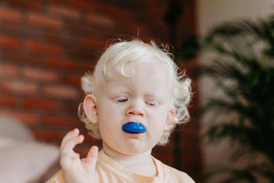 Illustration of a child biting into a chewable toy