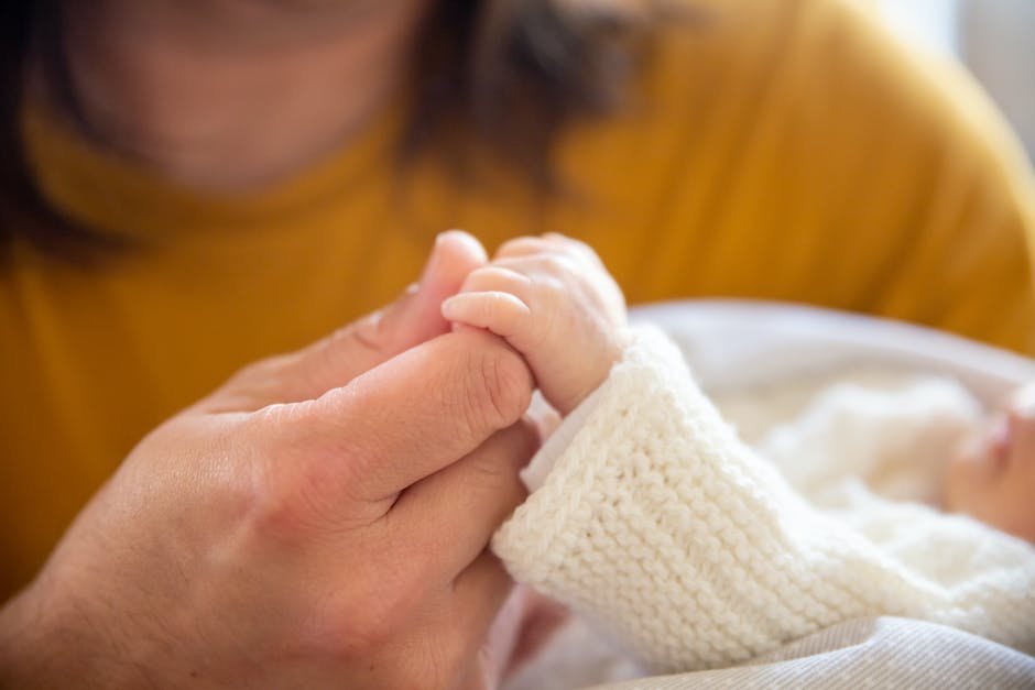 A caring parent holding the hand of a child with autism, supporting and guiding them.