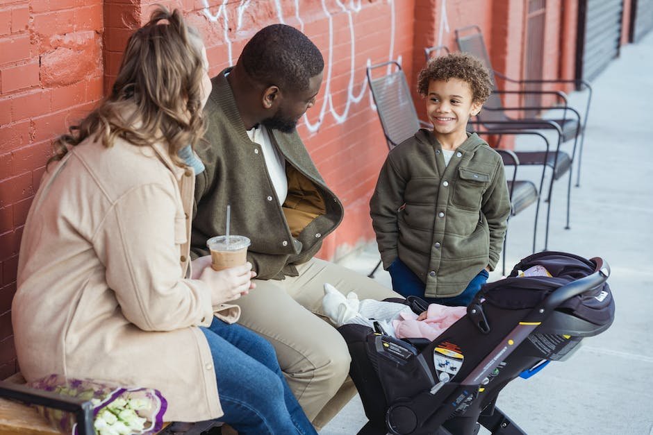 An image depicting a diverse family with an autistic child, showing them discussing and planning their financial future.