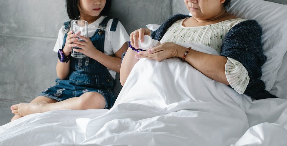 Image depicting a parent and an autistic child sitting together and discussing medication administration.
