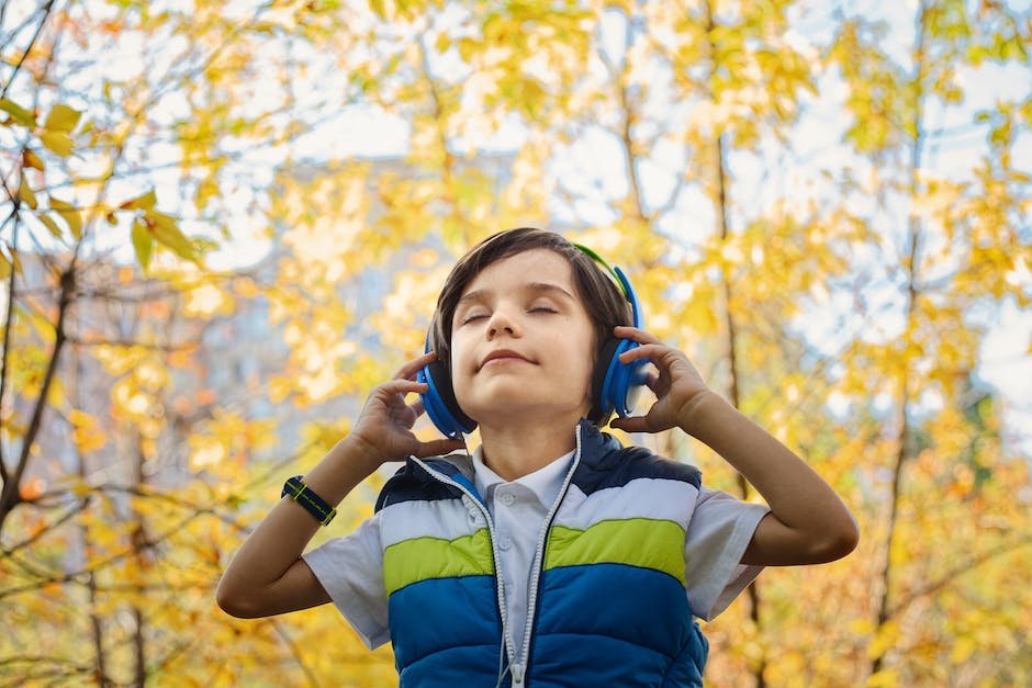 Image of a child wearing sound-blocking headphones, representing sensory processing issues in autism