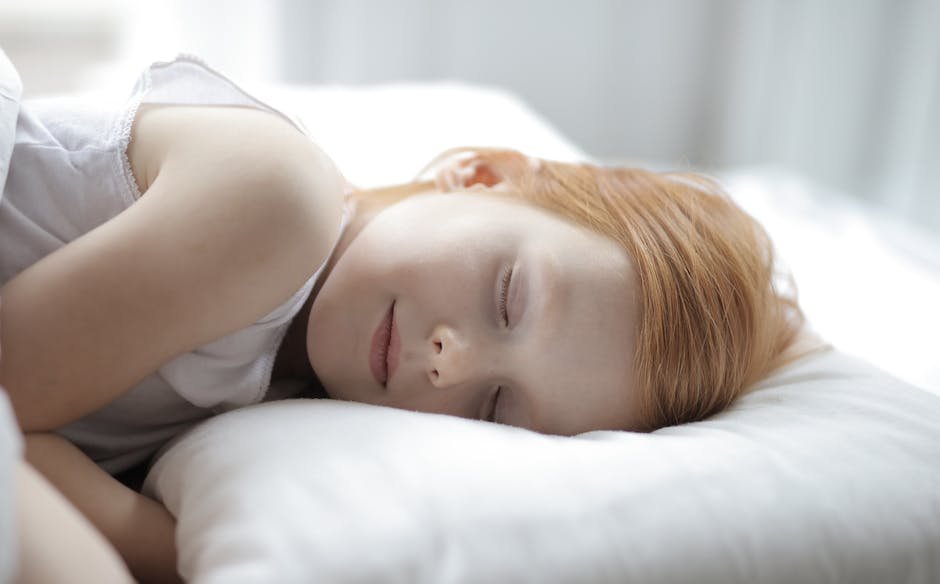 Image of a peaceful child sleeping in bed
