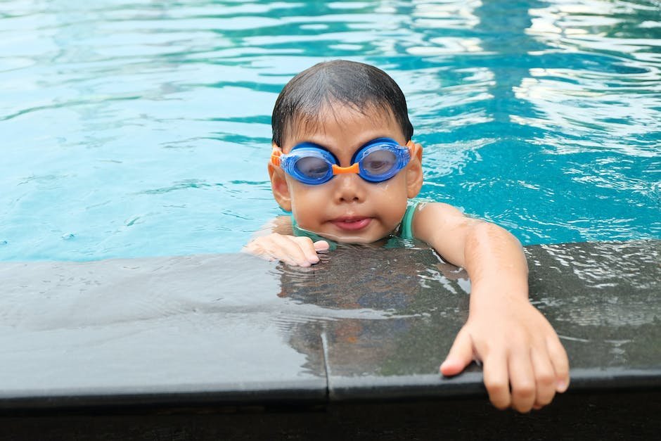 Illustration of a child with autism swimming happily in a pool