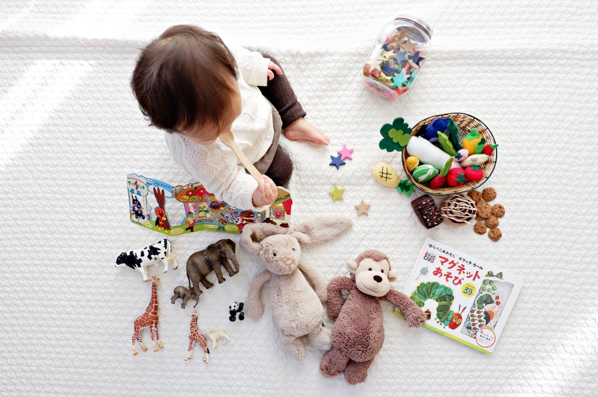 Illustration of a child surrounded by toys, representing toy hoarding in autistic children