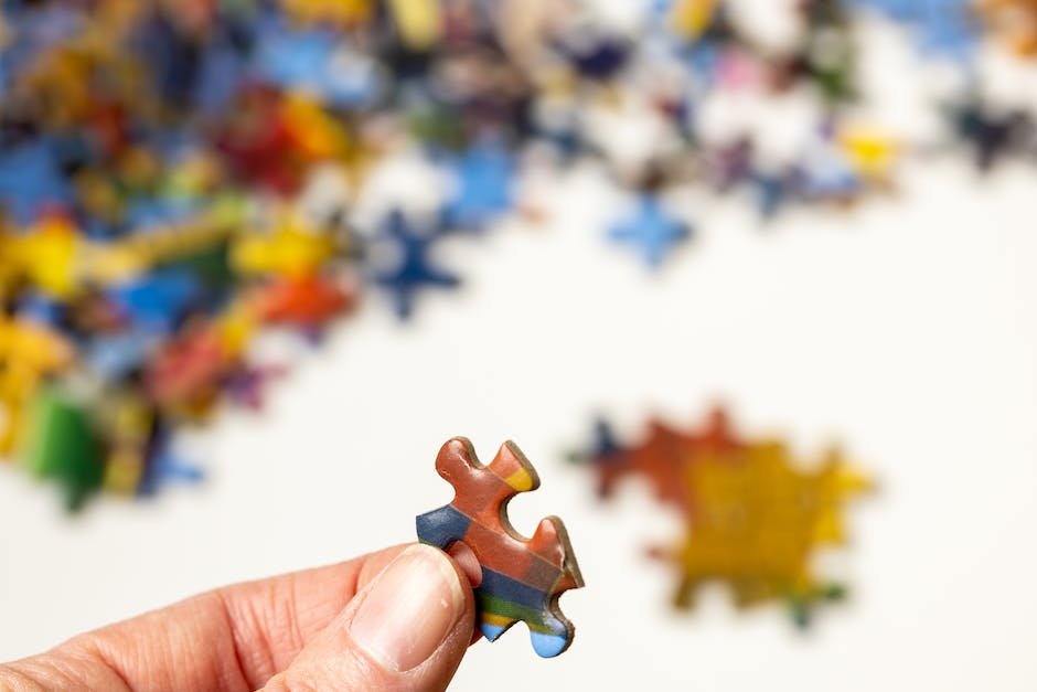 Image depicting a child holding a puzzle piece, representing the complex nature of understanding Autism Wandering and its causes.
