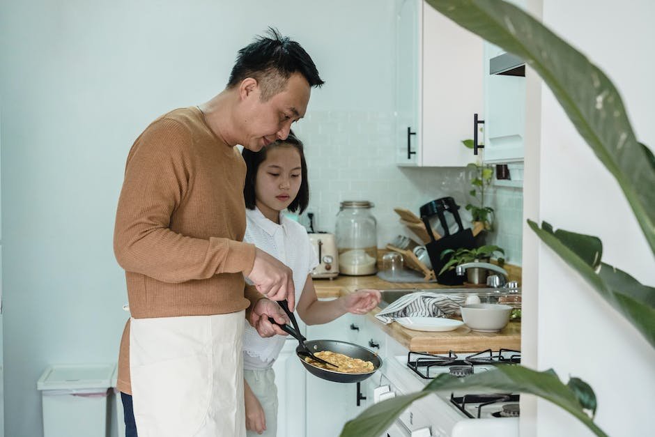 Illustration of a parent and a child cooking together in the kitchen.