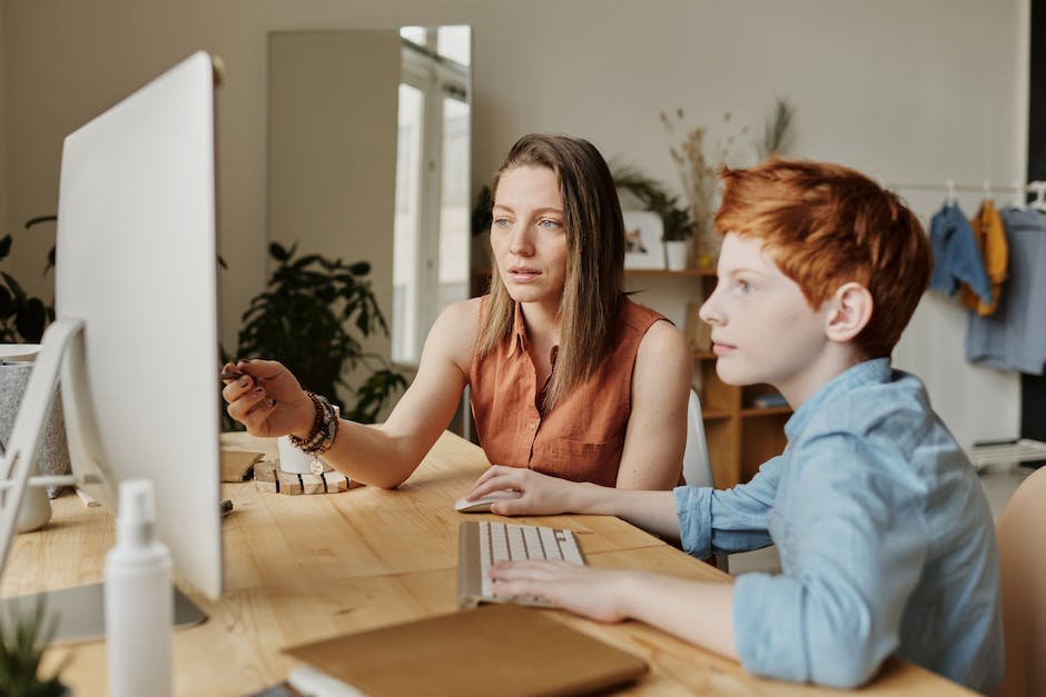 An image showing a parent and a child engaging in a conversation using visual aids